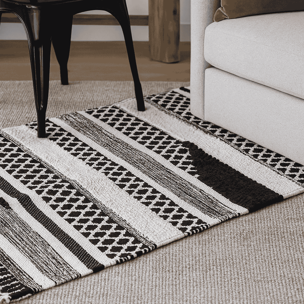 Full view of the monochrome panelled cotton rug