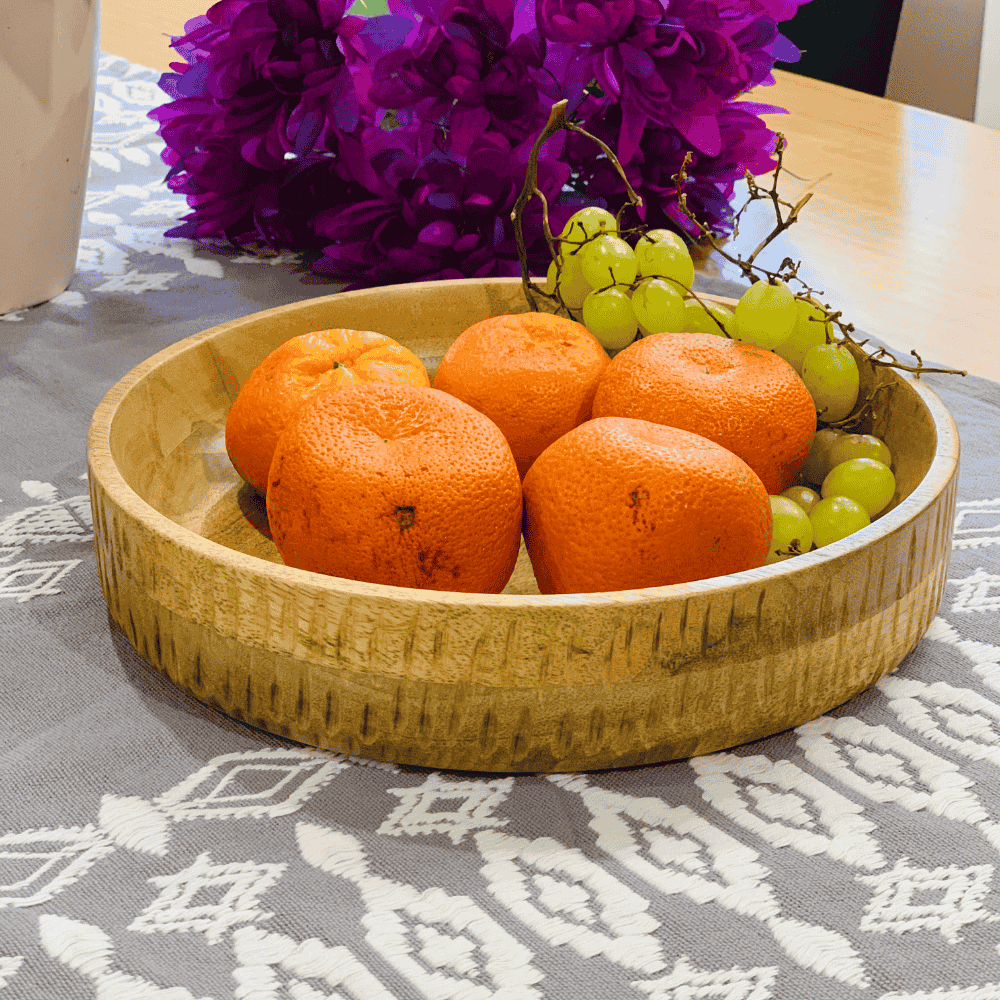 Carved wood platter styled with food