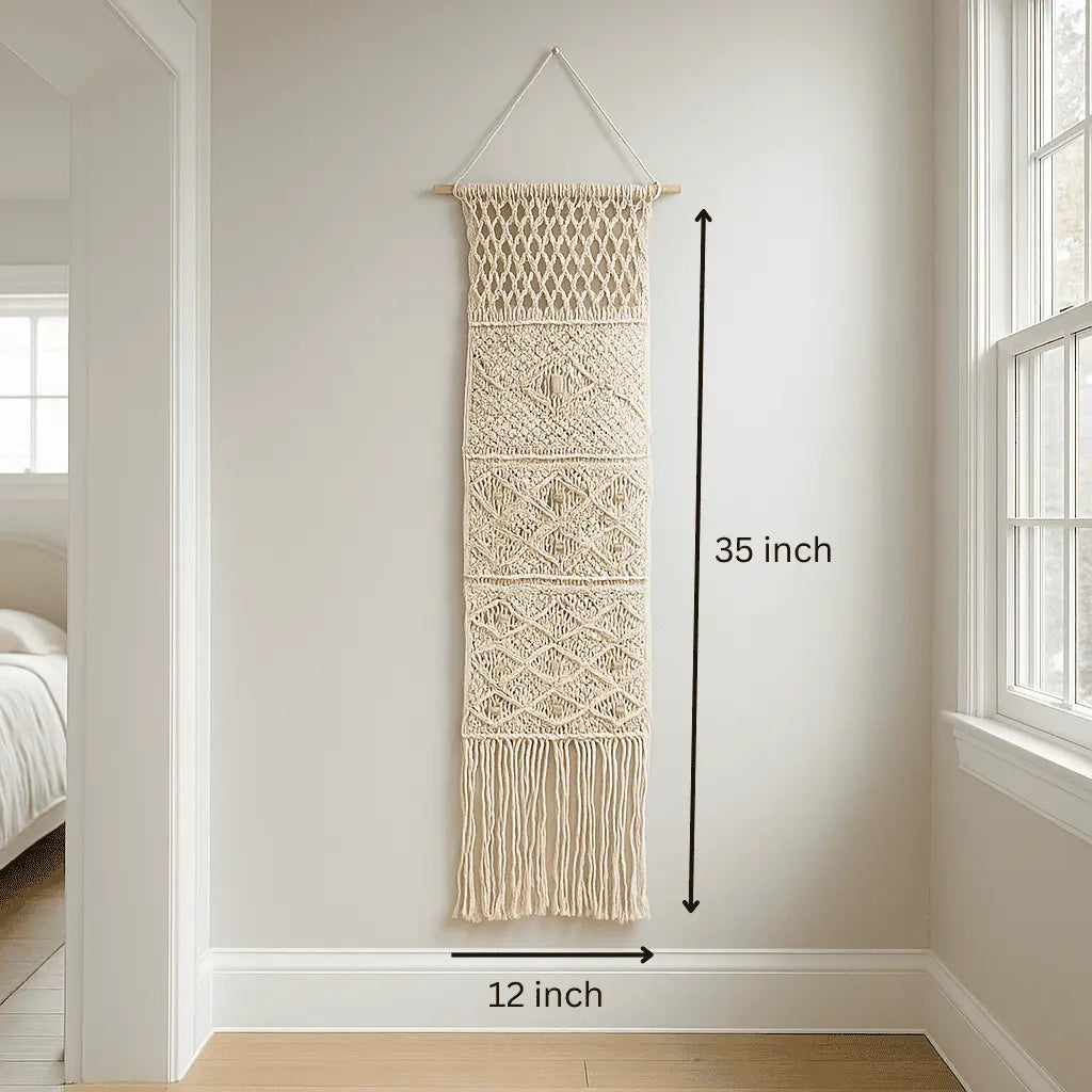 Macrame wall hanging with pocket holding dried stems
