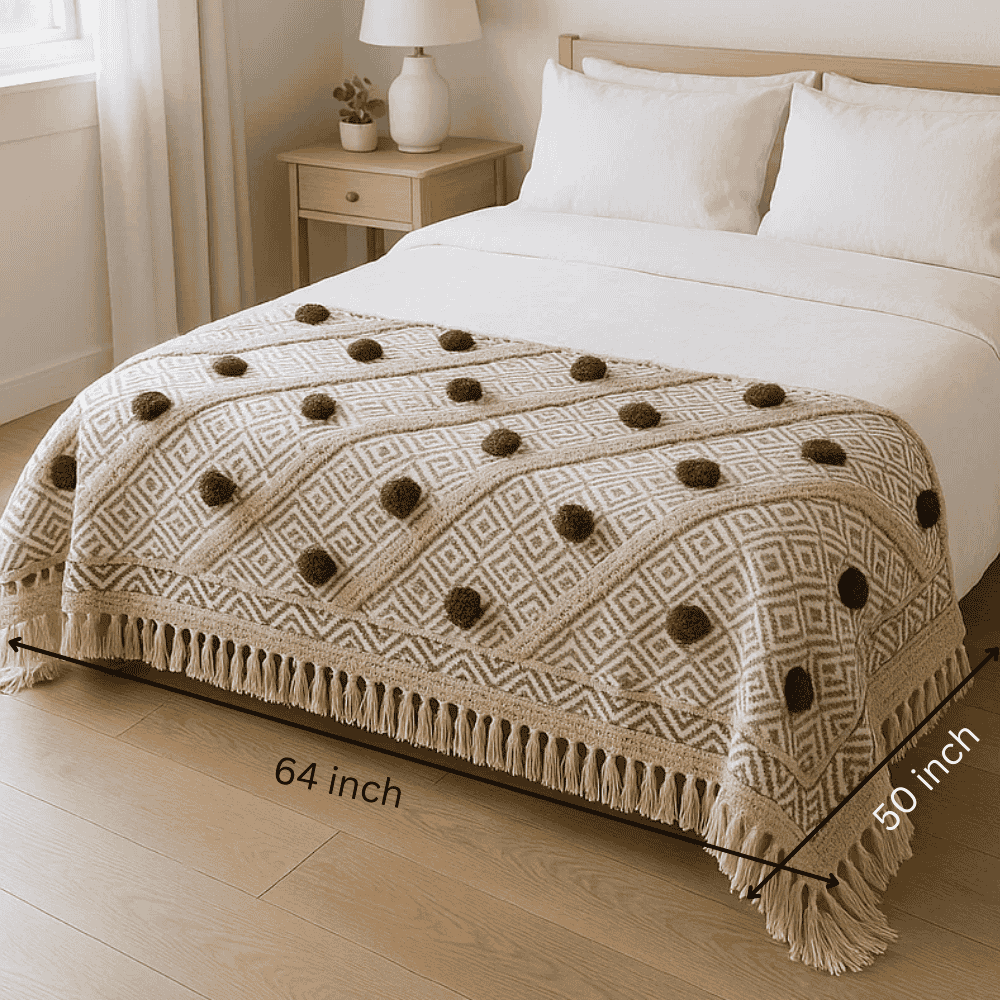 Pom pom throw blanket folded detail