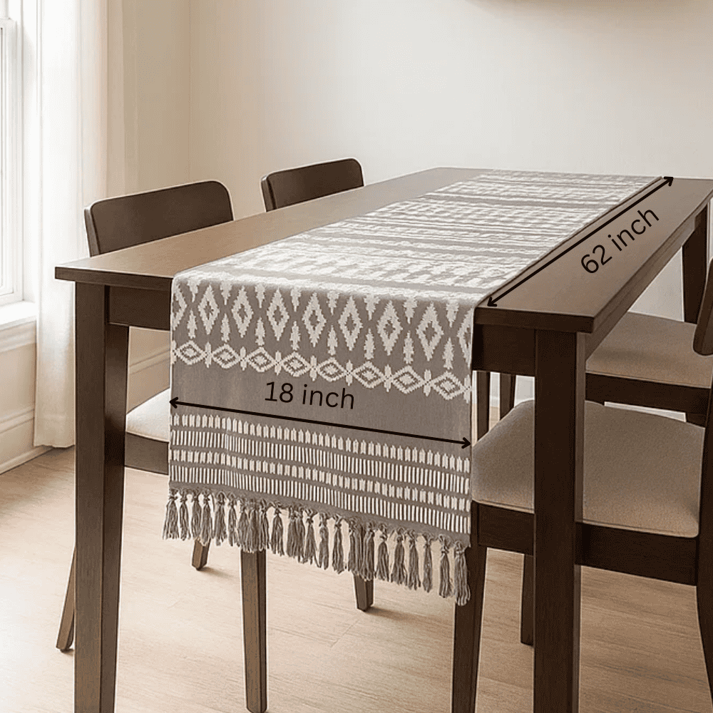 Embroidered cotton table runner tassel detail