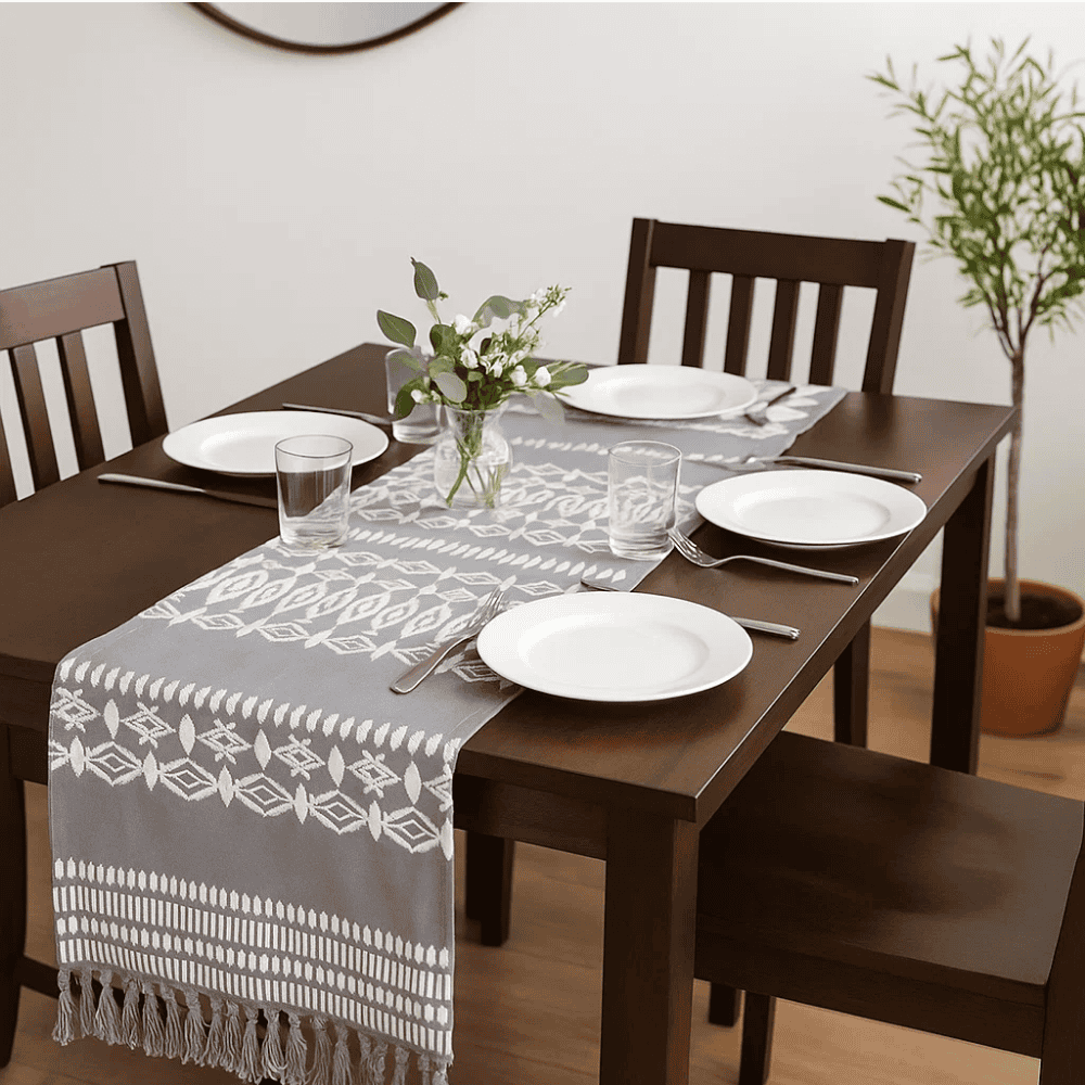 Embroidered cotton table runner at an angle