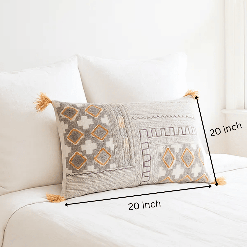Printed embroidered lumbar cushion cover styled on a sofa