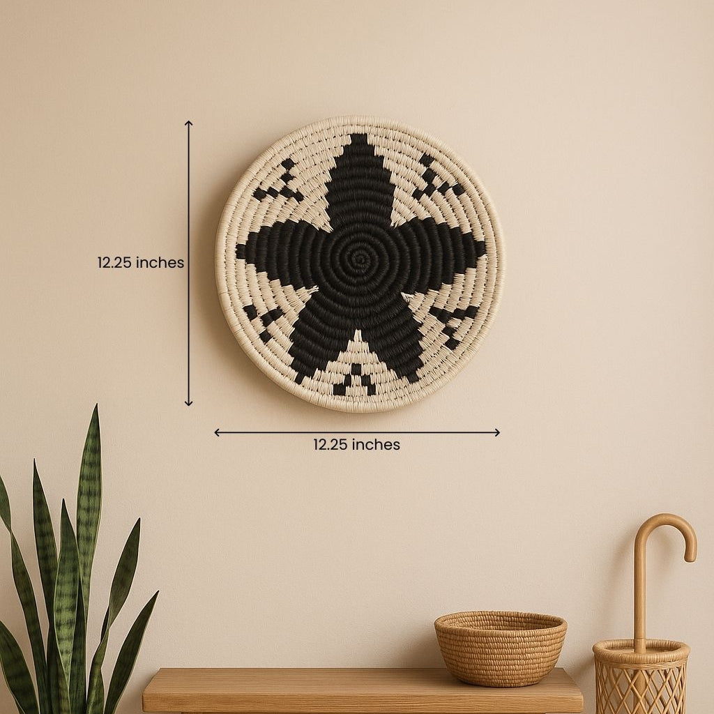 Black and white floral wall plate grouped with other plates