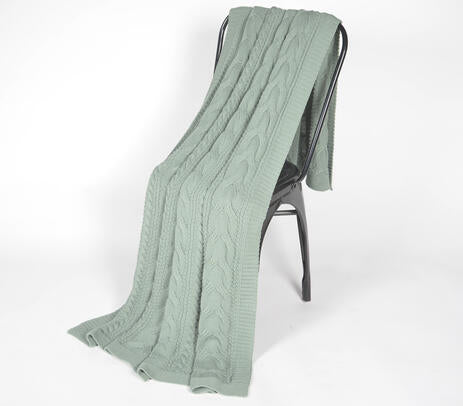 Sage green throw blanket lifestyle shot
