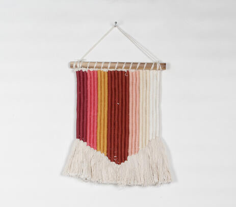 Tasseled rope wall hanging shown with hanging rod detail