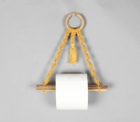 Mustard macrame and wood toilet roll holder product photo on white