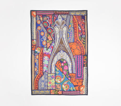 Upcycled fabric wall hanging styled grouped with other boho textiles