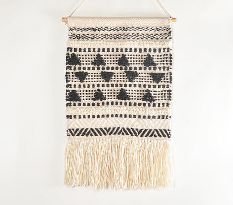 Textured wool and cotton wall hanging styled in a Scandi room