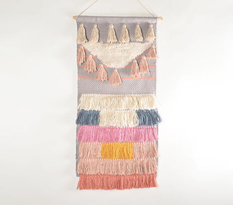 Pastel wool and cotton wall hanging on a plain wall
