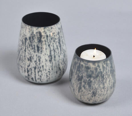 Monochrome black and white glass votives flat lay
