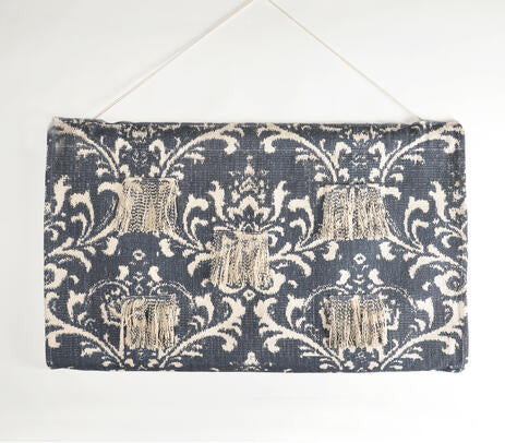 Damask patchwork wall hanging shown with hanging rod detail