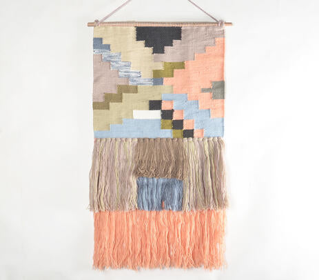 Colour block wool wall hanging in a playful kids room
