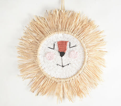 Cotton lion wall hanging above a cot