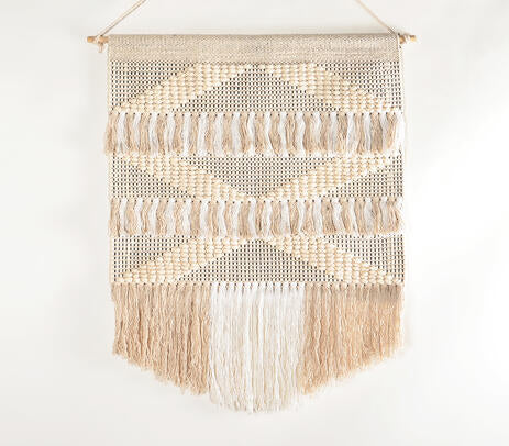 White and beige cotton wall hanging detail of the wood rod hanger