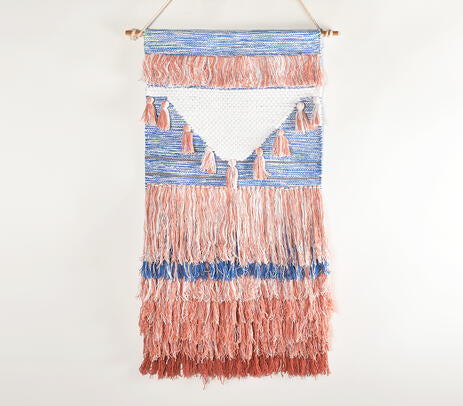 Mediterranean cotton wall hanging on a limewash plaster wall