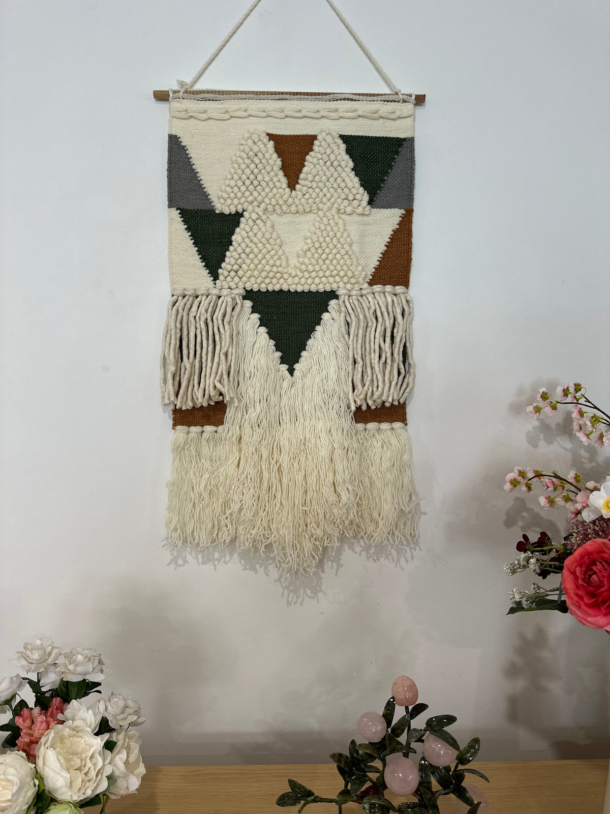 Loop and pile wool wall hanging close-up of geometric shapes