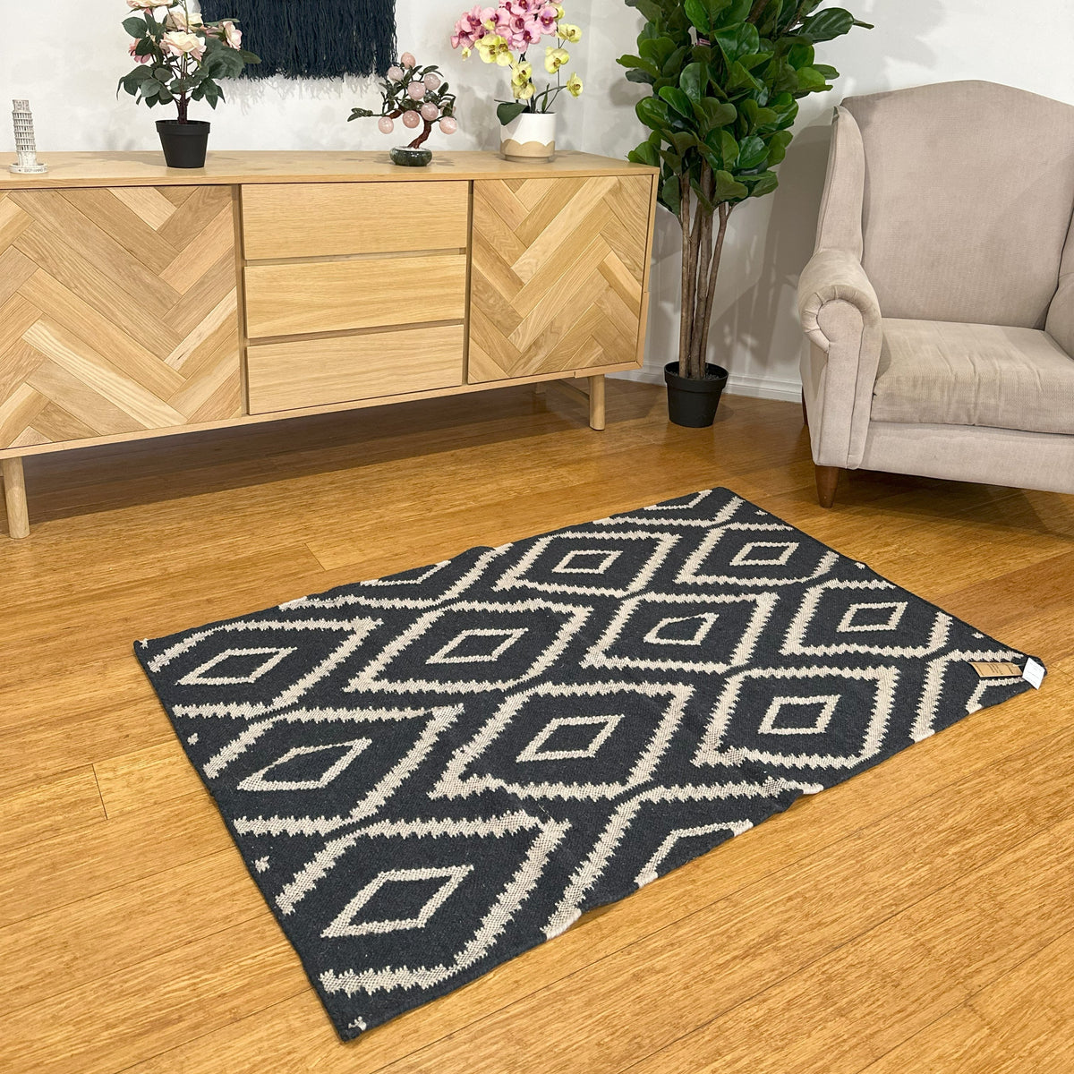 Rug shown partly turned back to reveal its reverse
