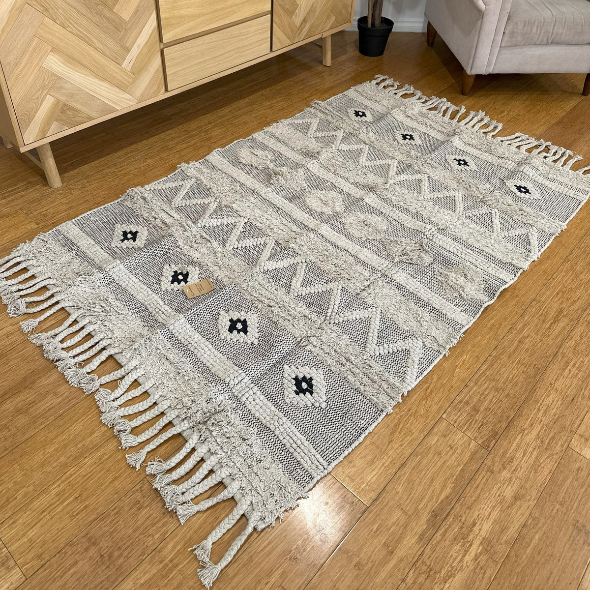 Close-up of the braided tassels at the rug edge