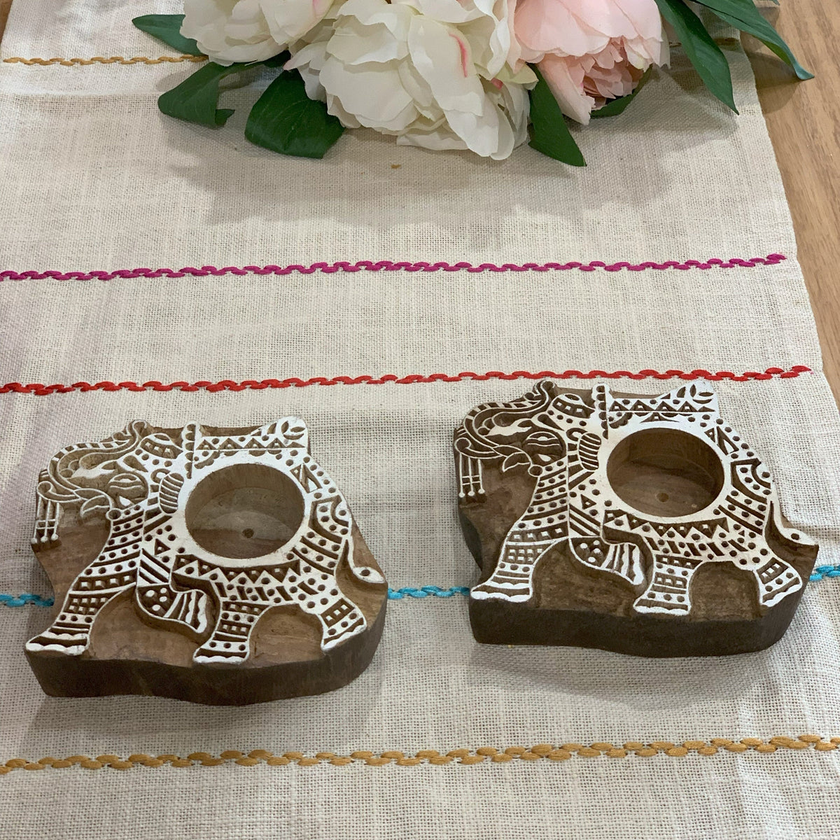 Hand carved elephant tealight holders real product close-up