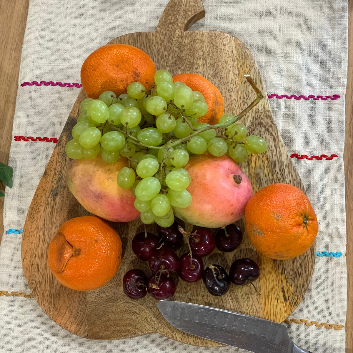 Pear shaped chopping board with cheese