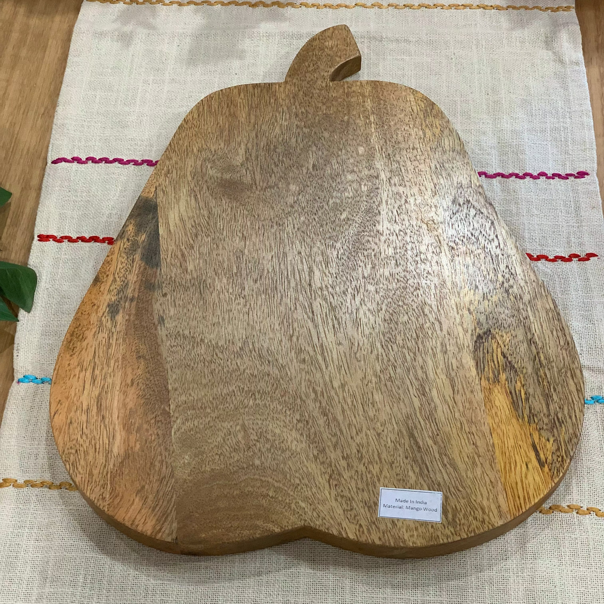 Pear shaped chopping board on a kitchen bench