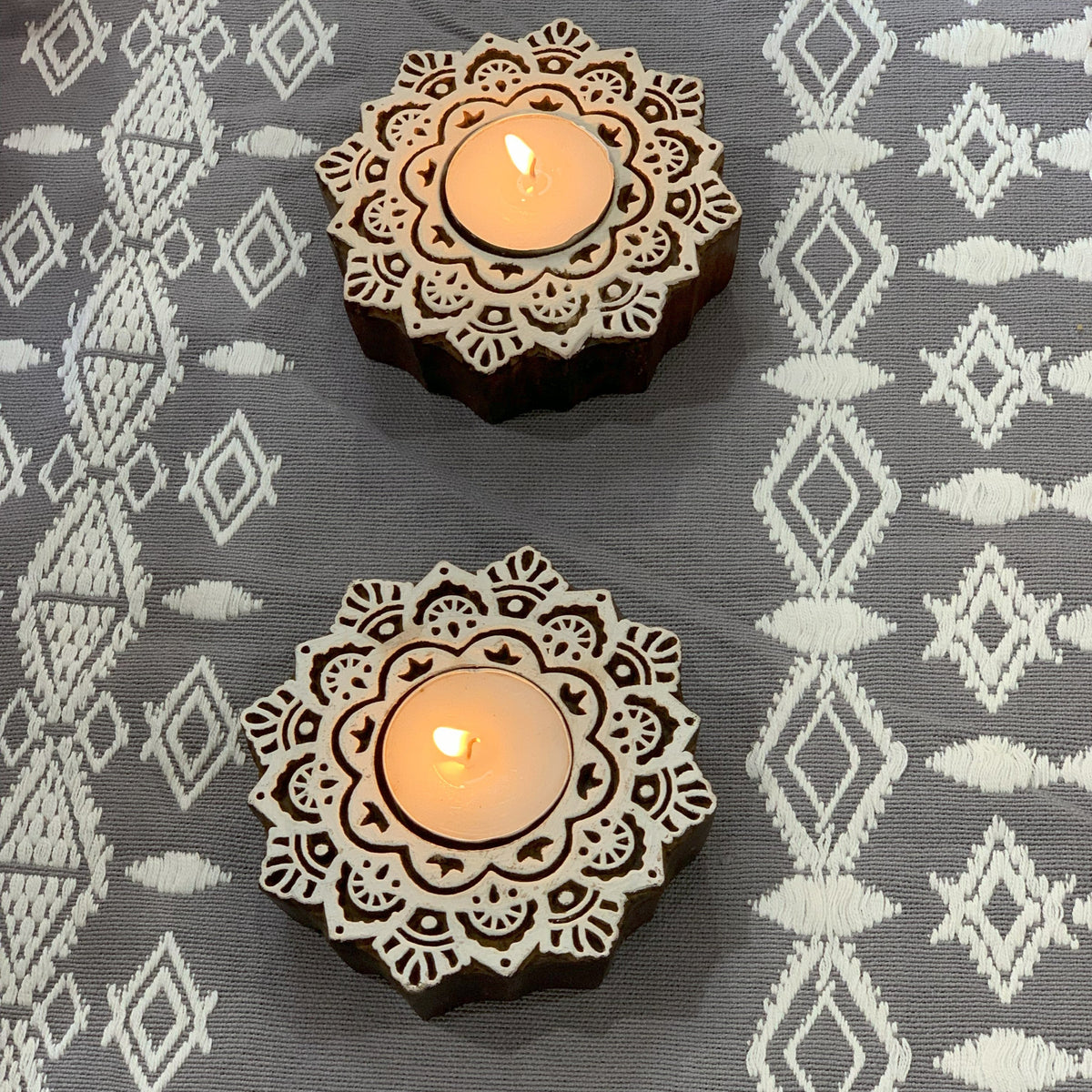 Wooden mandala holders angled close-up