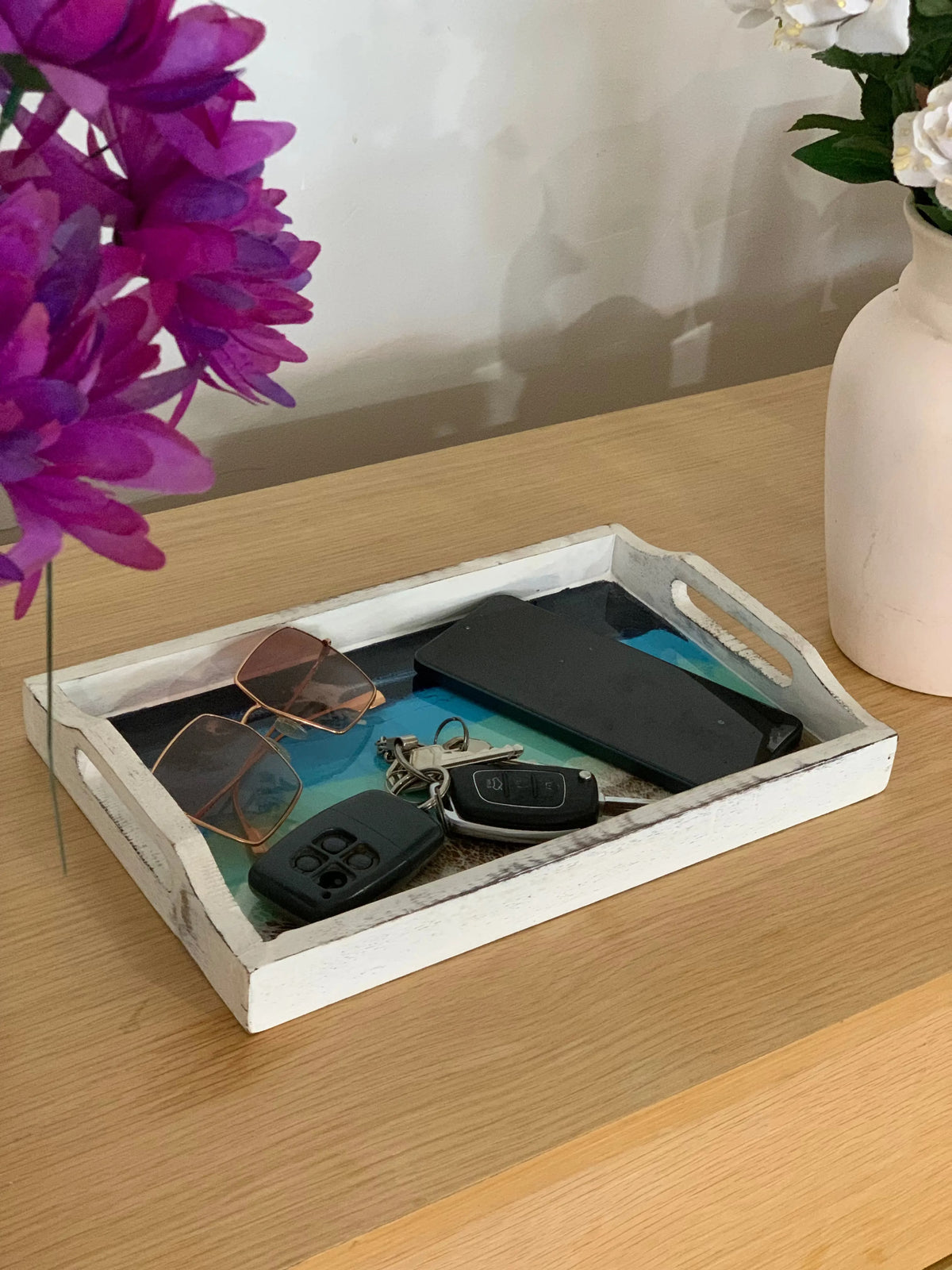 Abstract enamelled tray paired with tableware