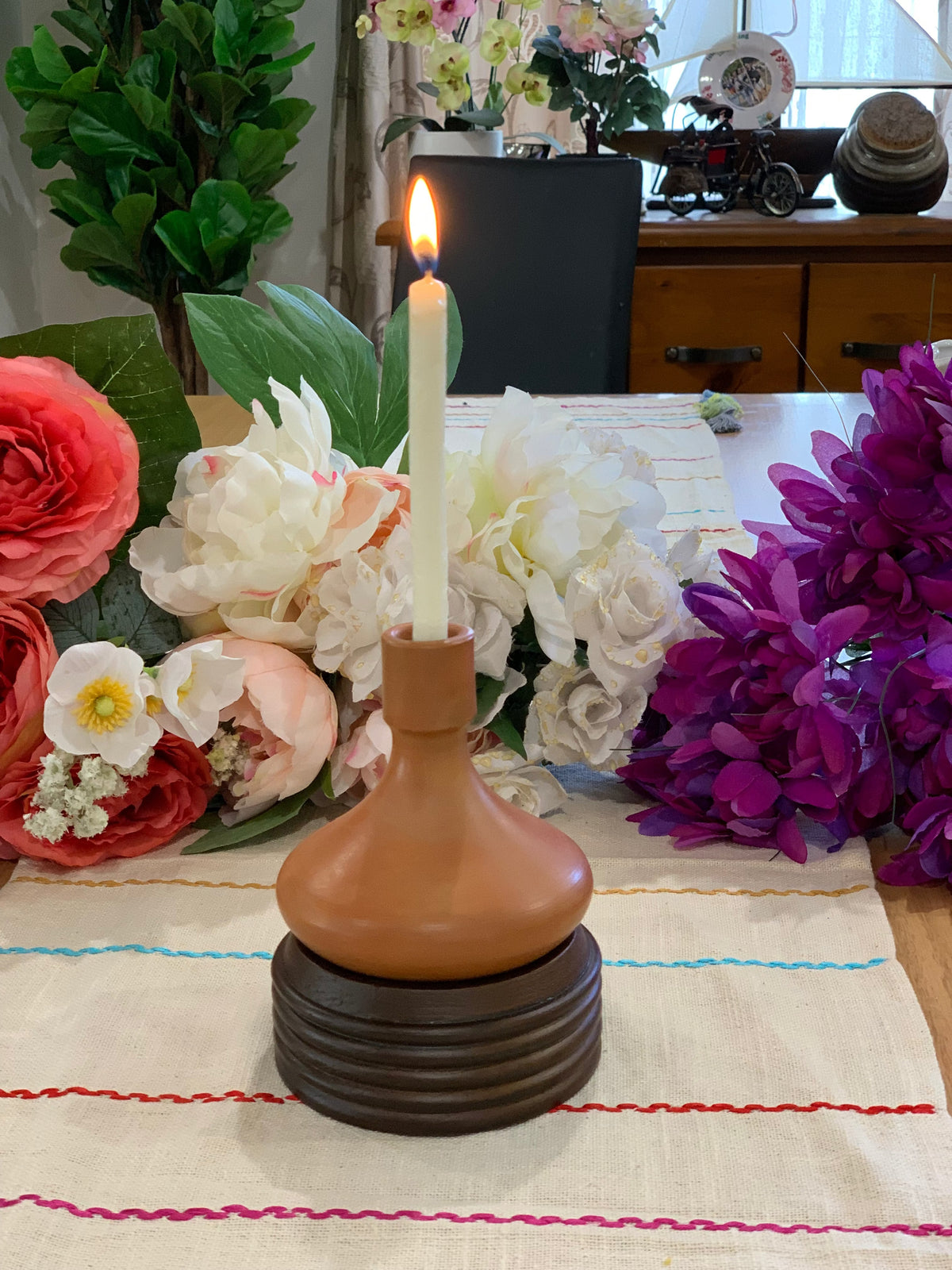 Terracotta candle holder on styled shelf