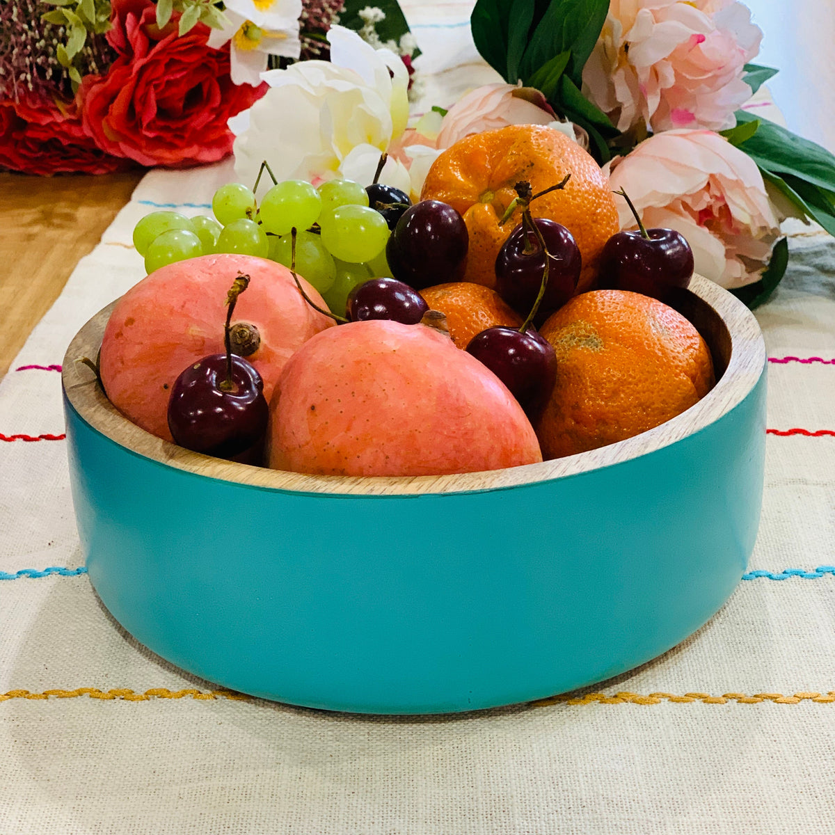 Aqua salad bowl paired with tableware