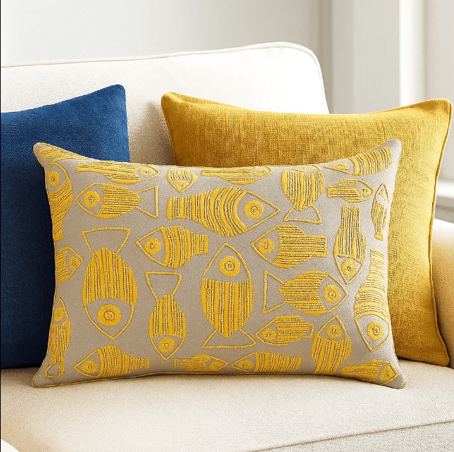 Fish embroidered cushion cover paired with other cushions