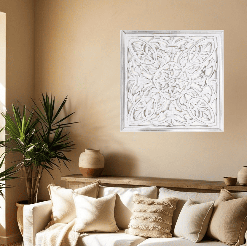 White distressed wall plaque above a console table