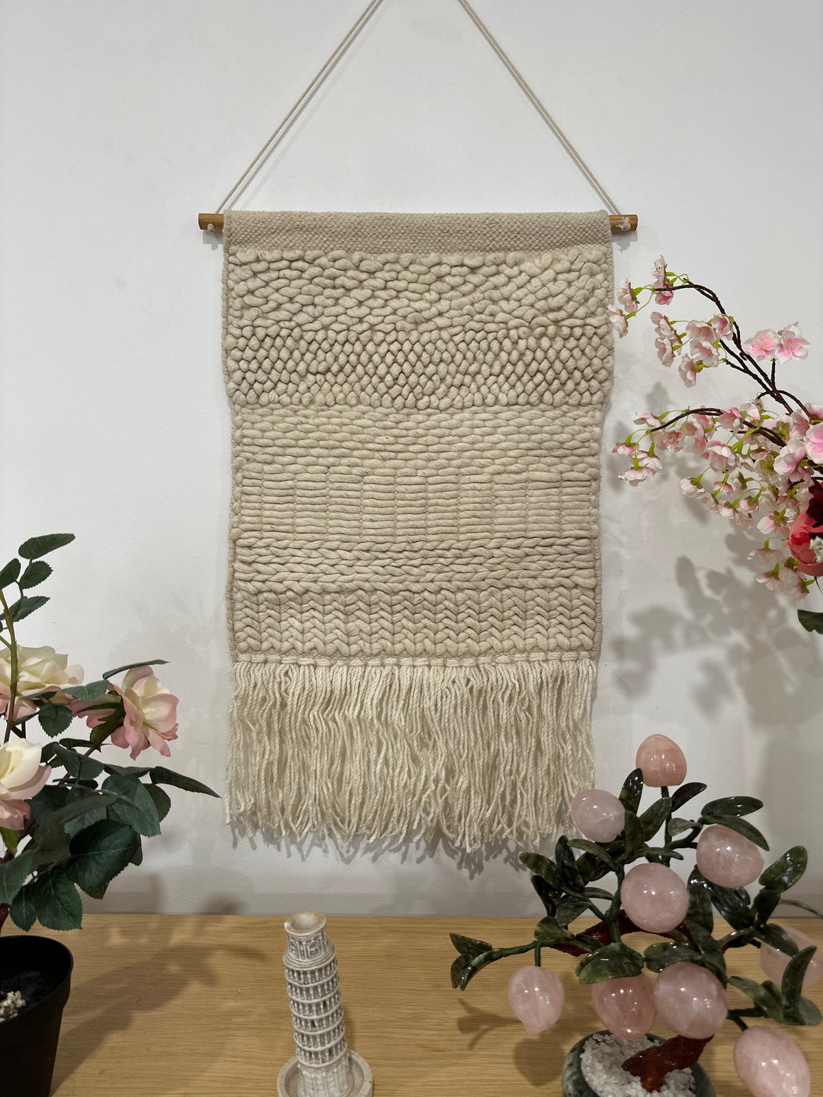 Fringed woolen wall hanging in beige and cream with textured weave – boho home decor for living room or bedroom