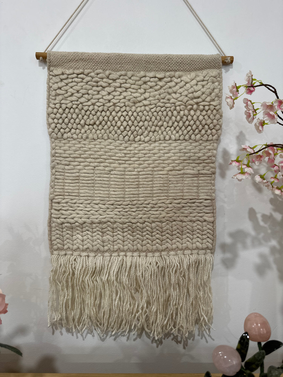 Fringed woolen wall hanging in beige and cream with textured weave – boho home decor for living room or bedroom